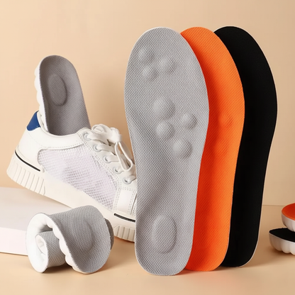 Stepmastr Relief Kinetic insoles in orange, grey, and black colors displayed next to a white sneaker.